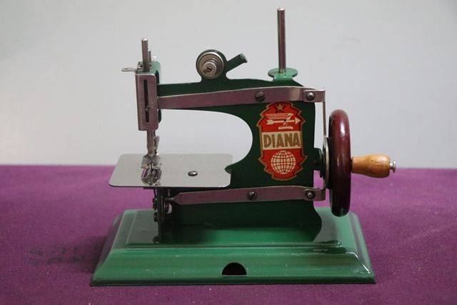 diana playing with toy sewing machine